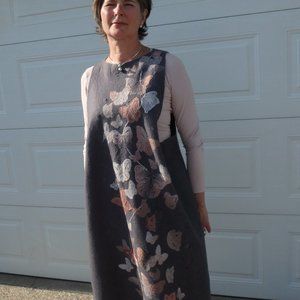 Handmade felted sundress with embroidery details.